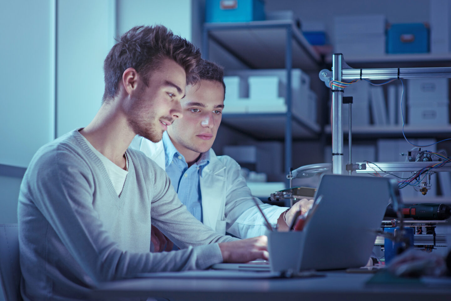 Engineering students in the lab at night